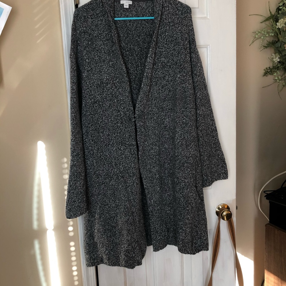 Sweater with pin closure .